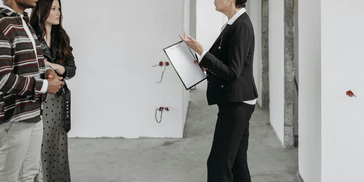 A client meeting with a real estate agent, illustrating the professional assistance available for property search.
