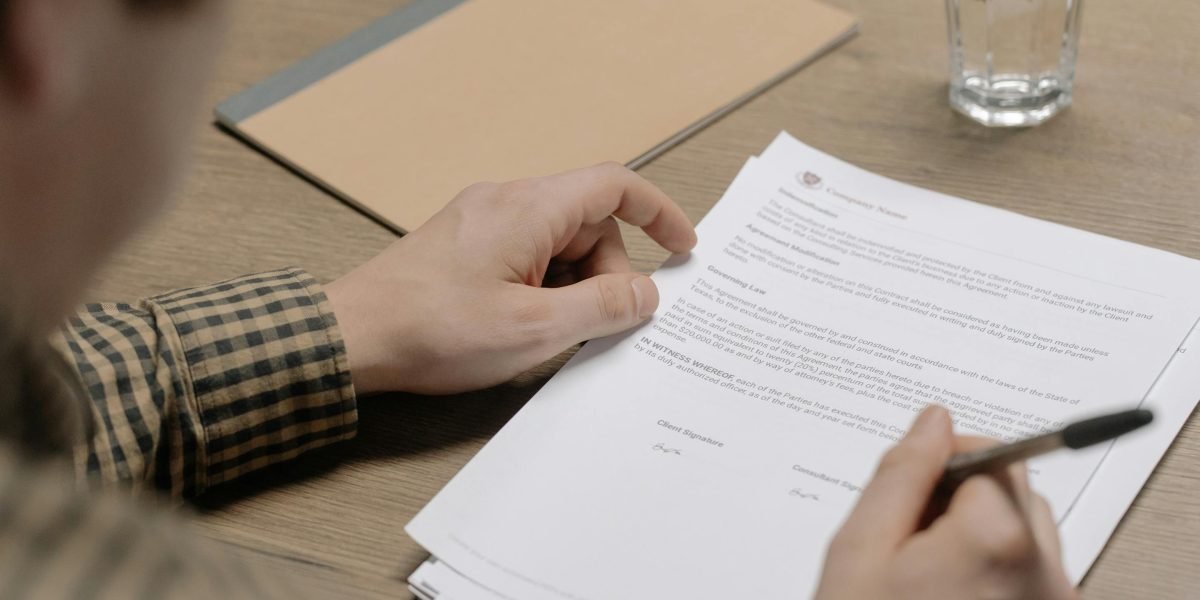 A person diligently reviewing a rental agreement, emphasizing the importance of understanding tenant rights.
