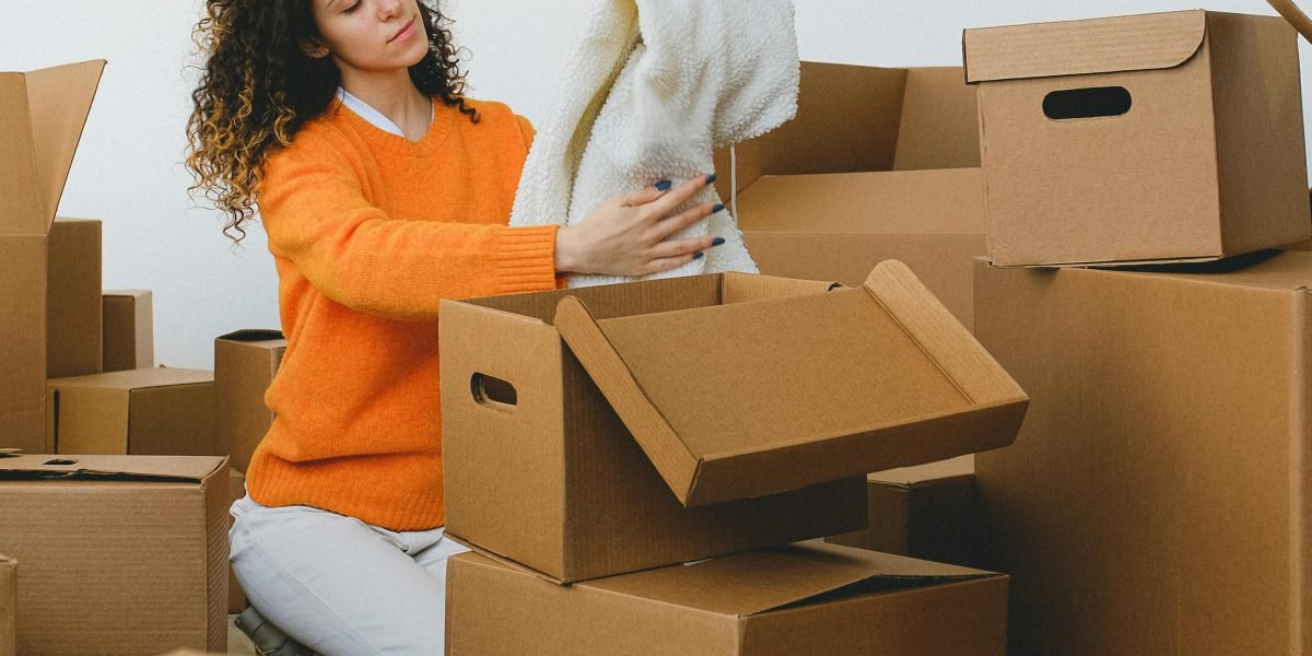 A person comfortably settling into a new home, reflecting the ease and convenience of furnished room rentals.