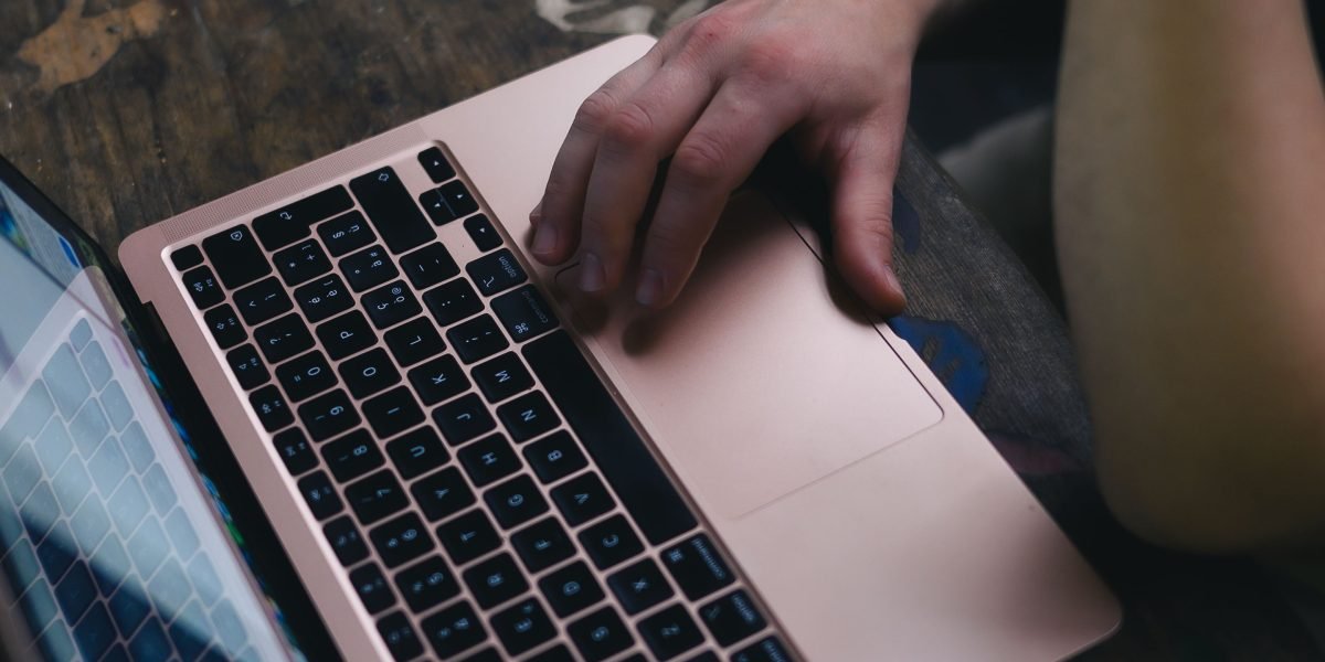 A person diligently searching online platforms for apartment listings, using filters to find the best match.